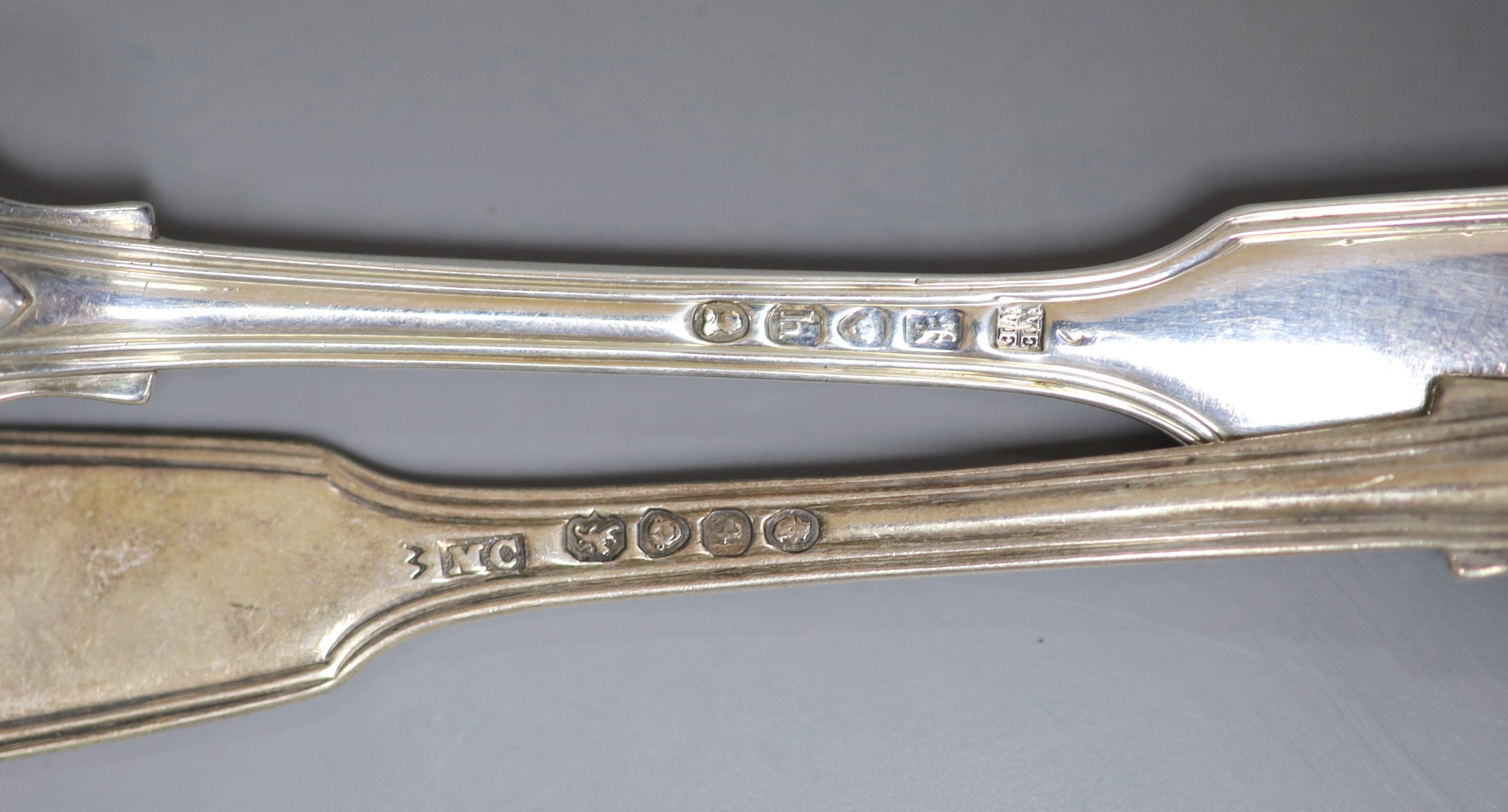 A set of six George IV silver fiddle, thread and shell pattern dessert forks, Eley & Fearn, London, 1823 and a harlequin set of six dessert spoons, 20oz